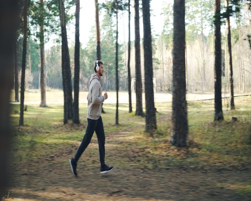 Healthy man running outdoors in nature
